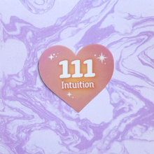 Load image into Gallery viewer, Pink and orange gradient heart-shaped sticker with '111 Intuition' white text on a marbled purple and white background
