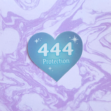 Load image into Gallery viewer, Blue gradient heart-shaped sticker with  '444 Protection' white text on a marbled purple and white background.
