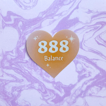 Load image into Gallery viewer, Orange gradient heart-shaped sticker with '888 Balance' white text on a purple and white marbled background.
